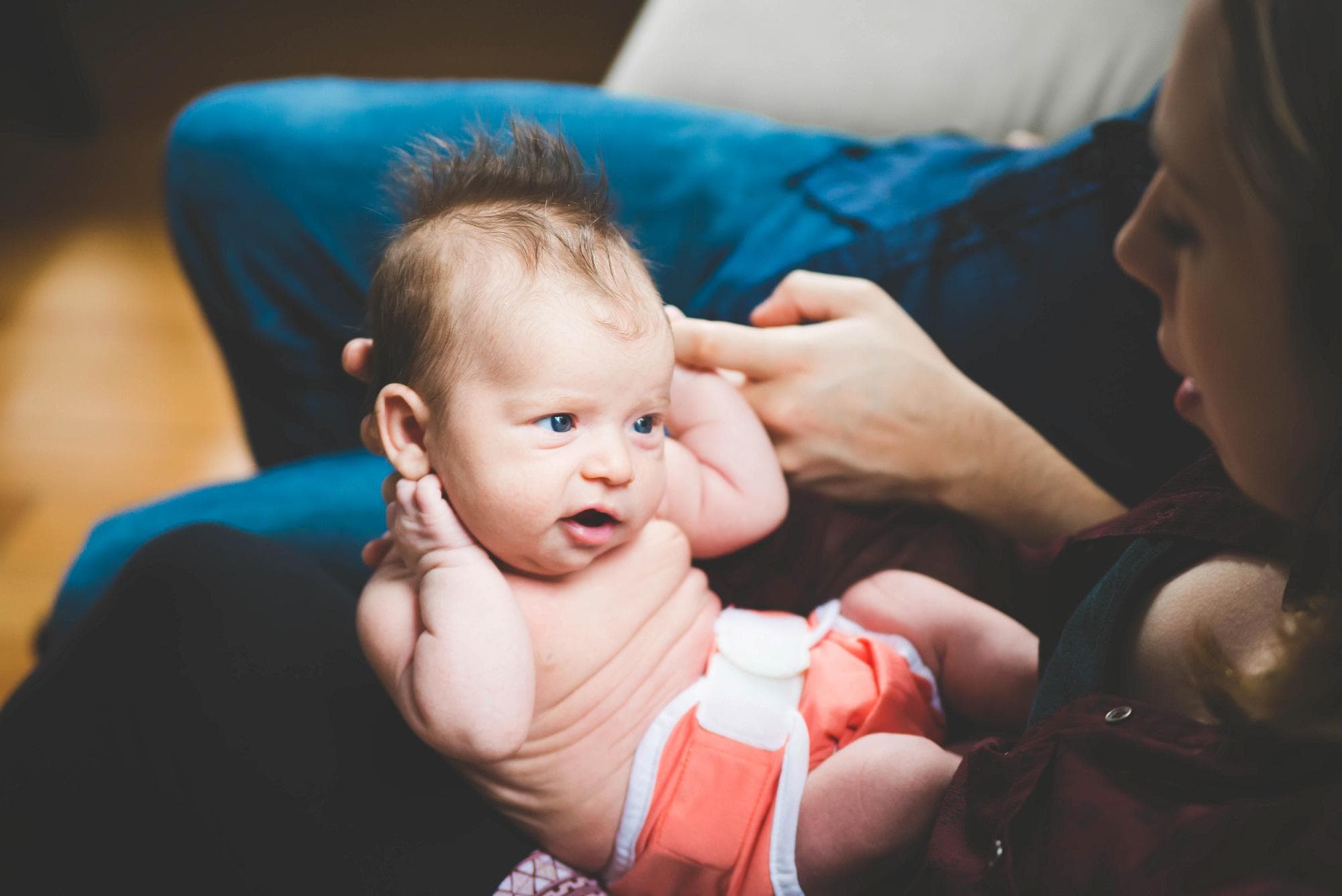 Newborn girl looking at dad lifestyle session